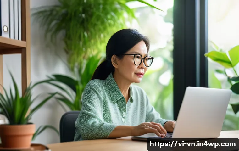 의식적 기술 사용의 심리적 장애물 - A Vietnamese middle-aged woman sitting at a desk in a cozy home office, cautiously looking at her la...